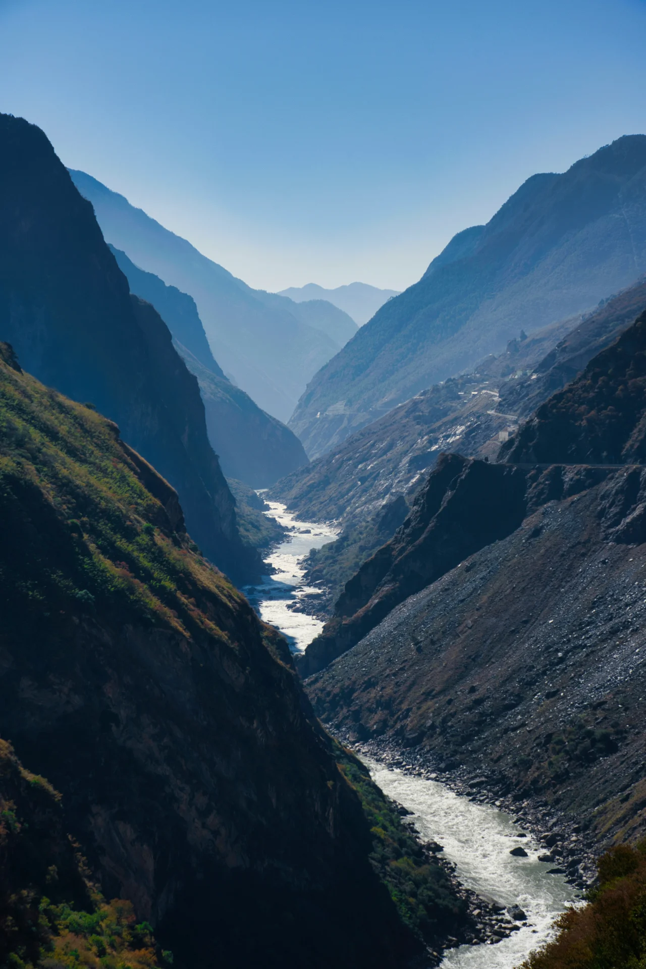 Tiger Leaping Gorge with the Jinsha River far below and snow-capped Jade Dragon Snow Mountain in the background